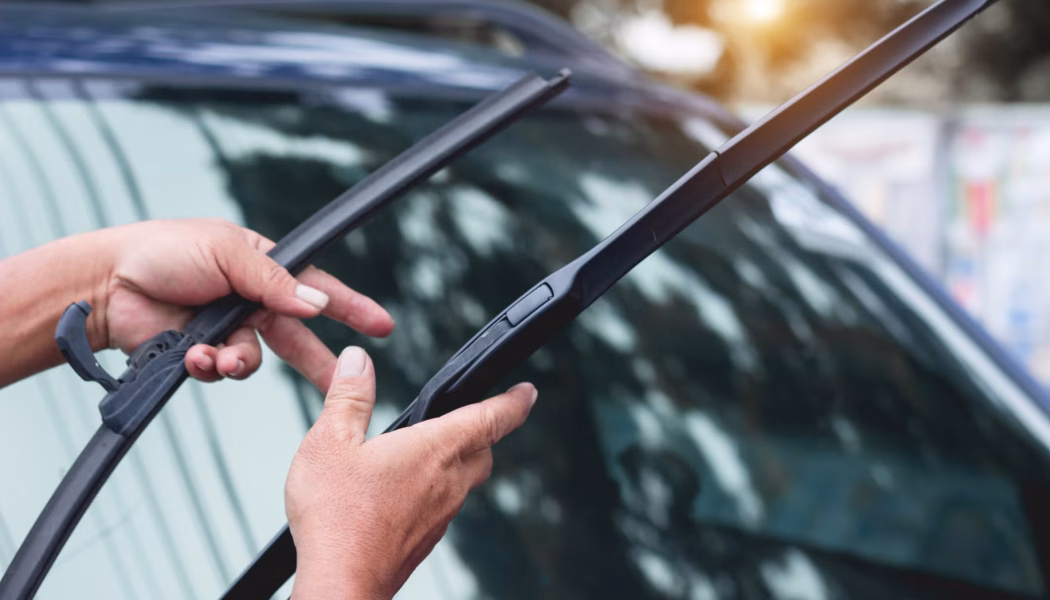 cropped-hands-holding-windshield-wiper-royalty-free-image-1635961668